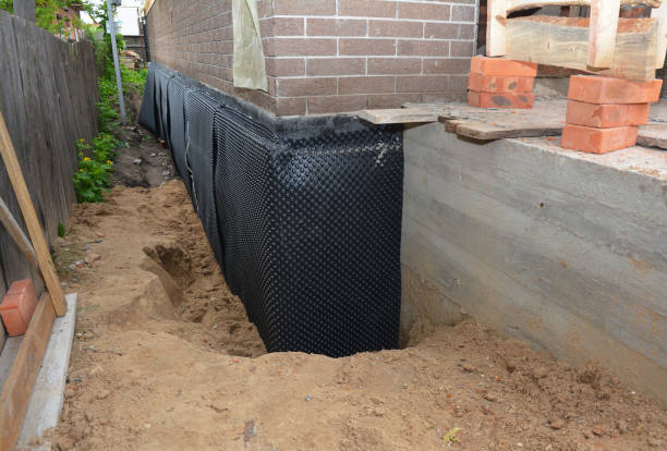 Happy homeowners after waterproofing job in Dorothy